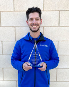 An Award Plaque Recognizing an Employee Named Chris for Excellence in Their Role in Texas, USA 