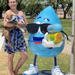 A Woman with a Dog at ClearWater Express Wash Event in Katy, TX